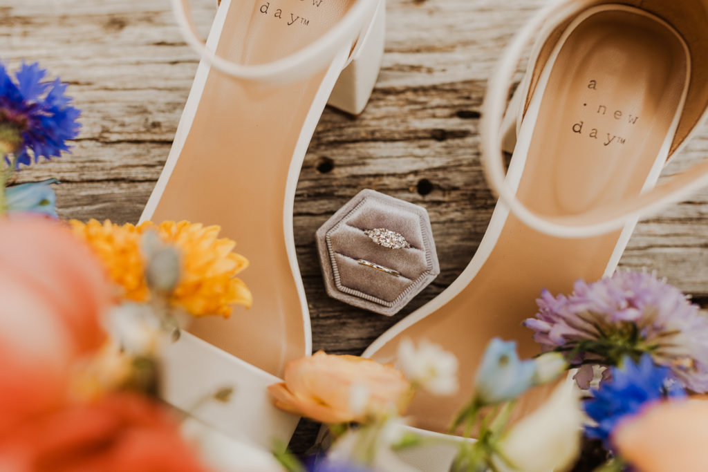 Bride shoes, flowers, and rings in Glacier National Park