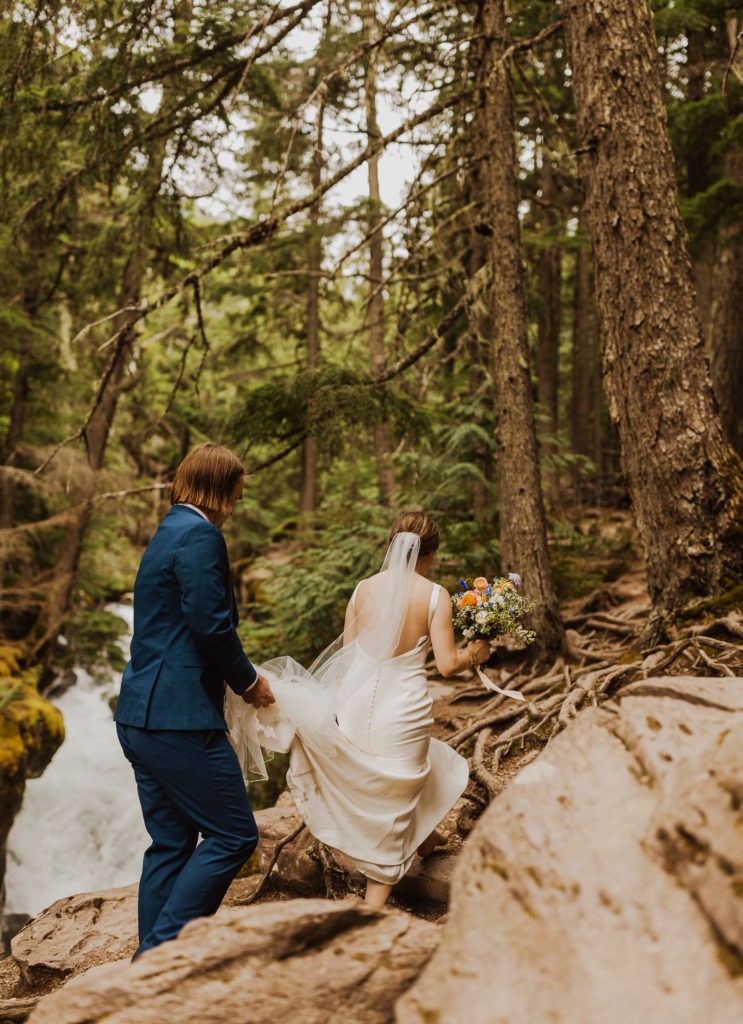 Bride and groom elopement hike in Glacier National Park after Lake McDonald Elopement.
