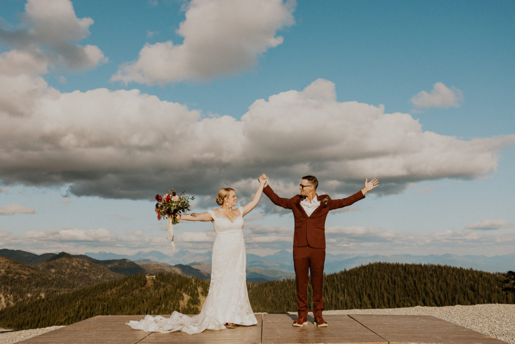 Whitefish Mountain Resort Wedding in Whitefish Montana Bride and Groom holding hands