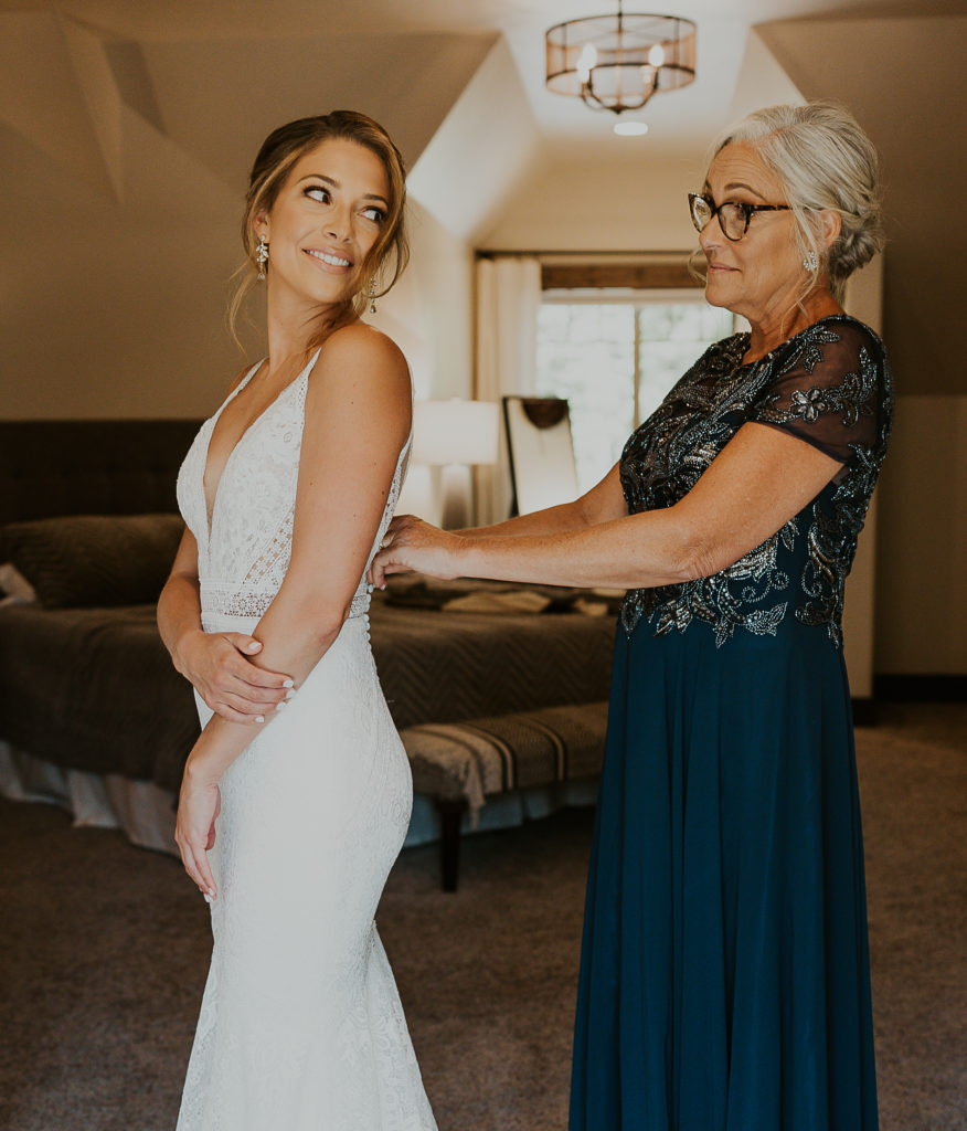 Glacier Raft Co Elopement near Glacier National Park. Bride and mother getting ready for ceremony. Elopement Photography by Haley Jessat
