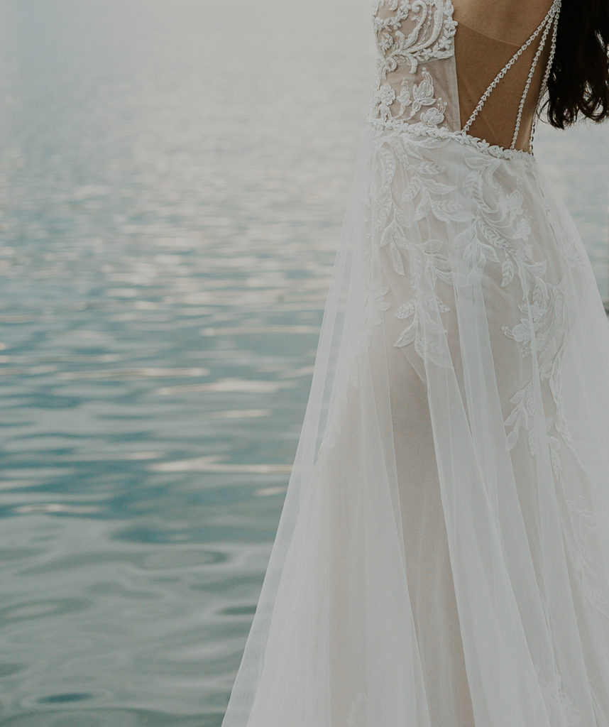 Wedding dress by a lake shot by HaleyJPhoto