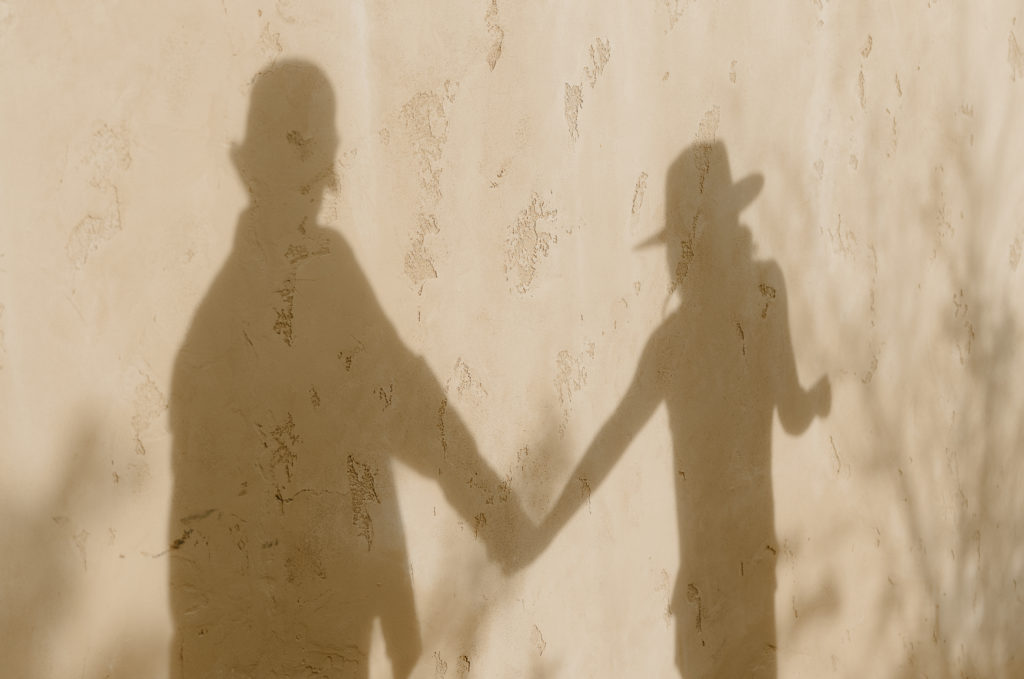 Holding hands shadow shot by Haley J Photo
