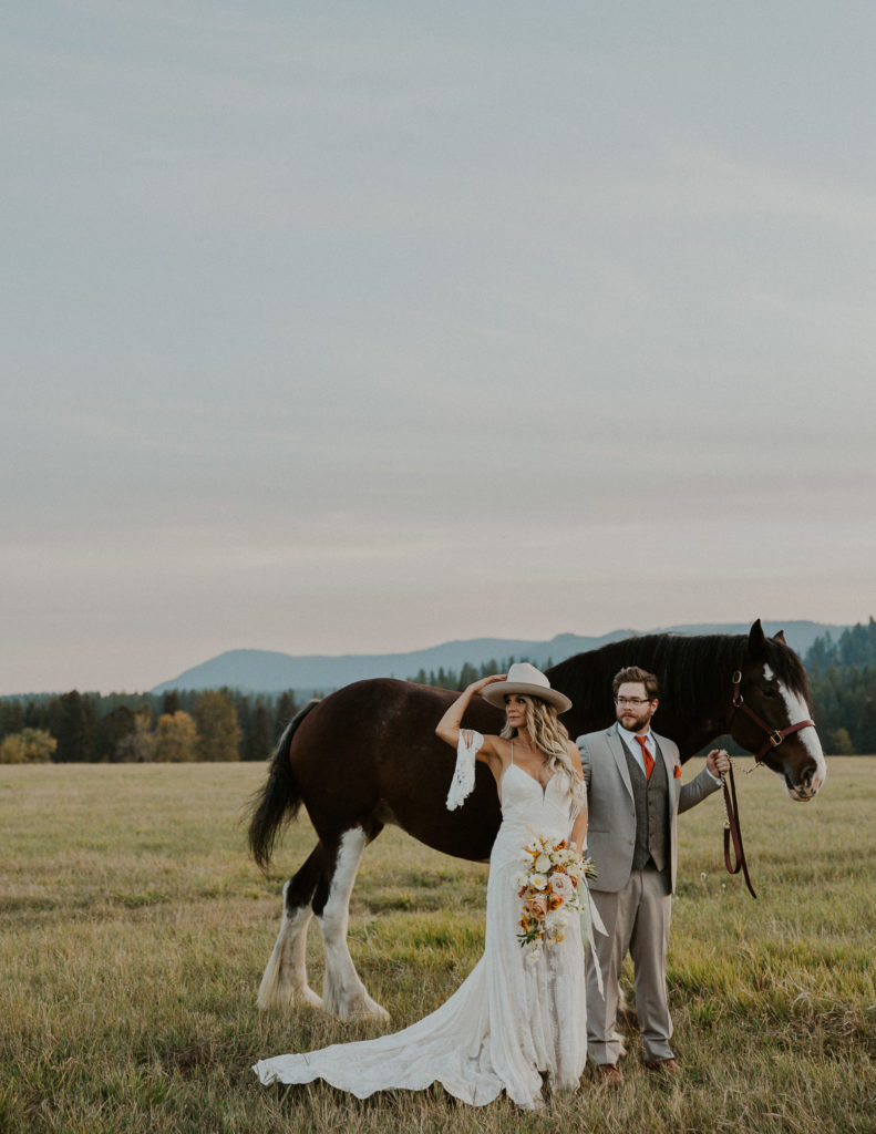 Bride and Groom with Clydesdale Montana Wedding Photography by HaleyJPhoto