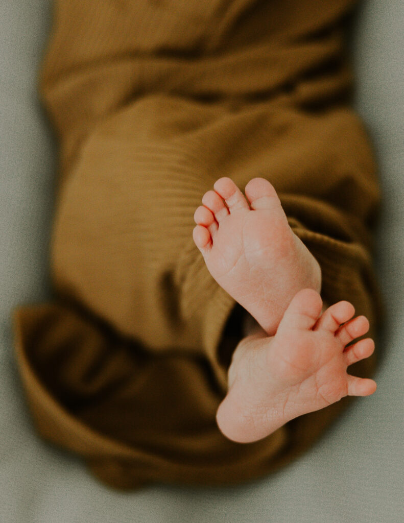 Newborn feet captured precious moments in a lifestyle newborn photoshoot