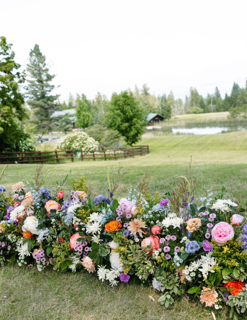 Beautiful floral arrangement with colorful flowers at a Montana ranch wedding venue, showcasing the natural beauty of Amen Ranch.