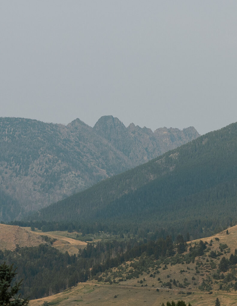 A landscape shot of the rugged Montana mountains surrounding Copper Rose Ranch Wedding Venue. Captured by Montana Wedding Photographer Haley J Photo.