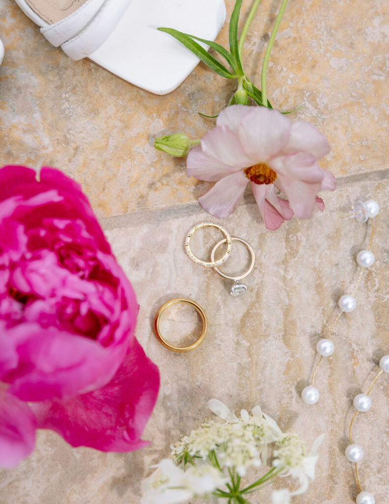 Bride’s earrings and floral accessories in preparation, highlighting storytelling details in Montana wedding photography.