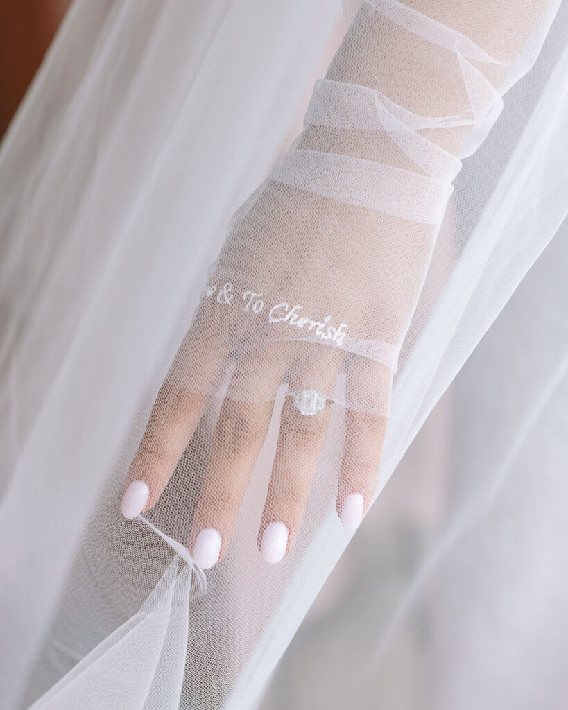 Bride reveals custom veil embroidery during Whitefish Montana wedding morning