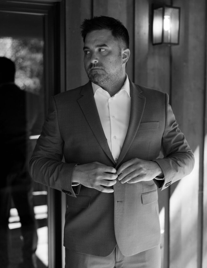 Airbnb Wedding Venue in Northwest Montana. Groom getting ready.