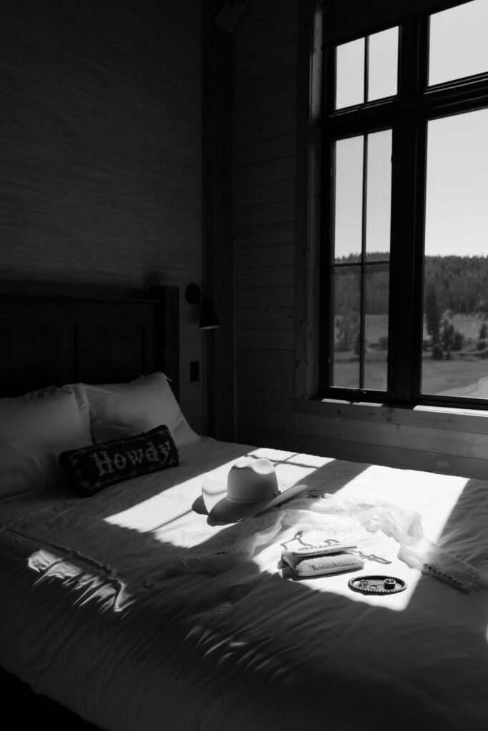 Bride and groom embracing beneath her veil, sharing a tender moment during their Western elopement at Clydesdale Outpost.