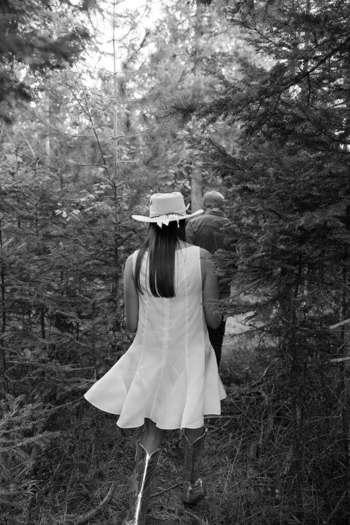 Bride and groom walking together across the lawn during the Iron Horse welcome party