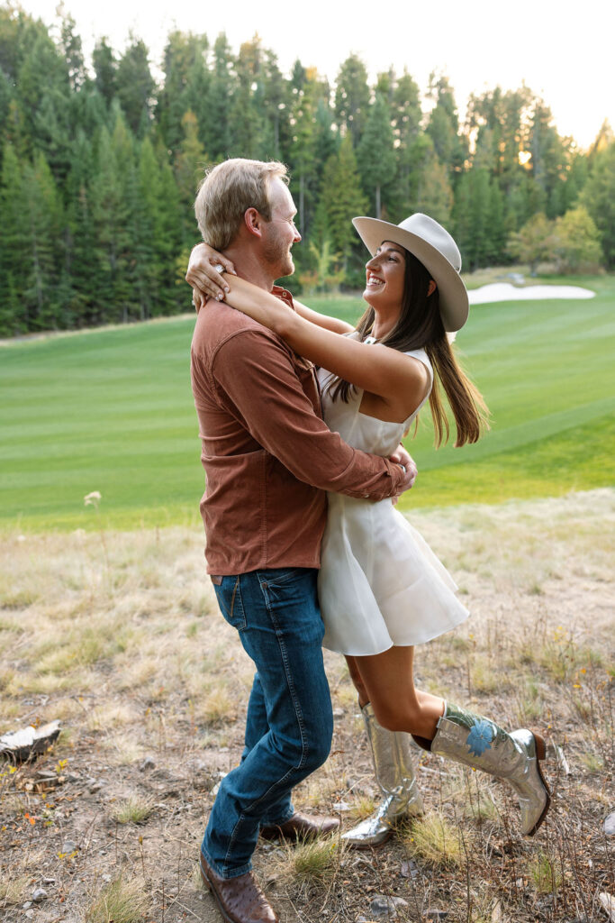 Bride and groom sharing a kiss at the welcome party in Whitefish Montana