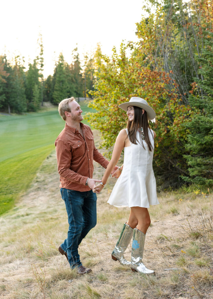 Bride and groom walking together across the lawn during the Iron Horse welcome party