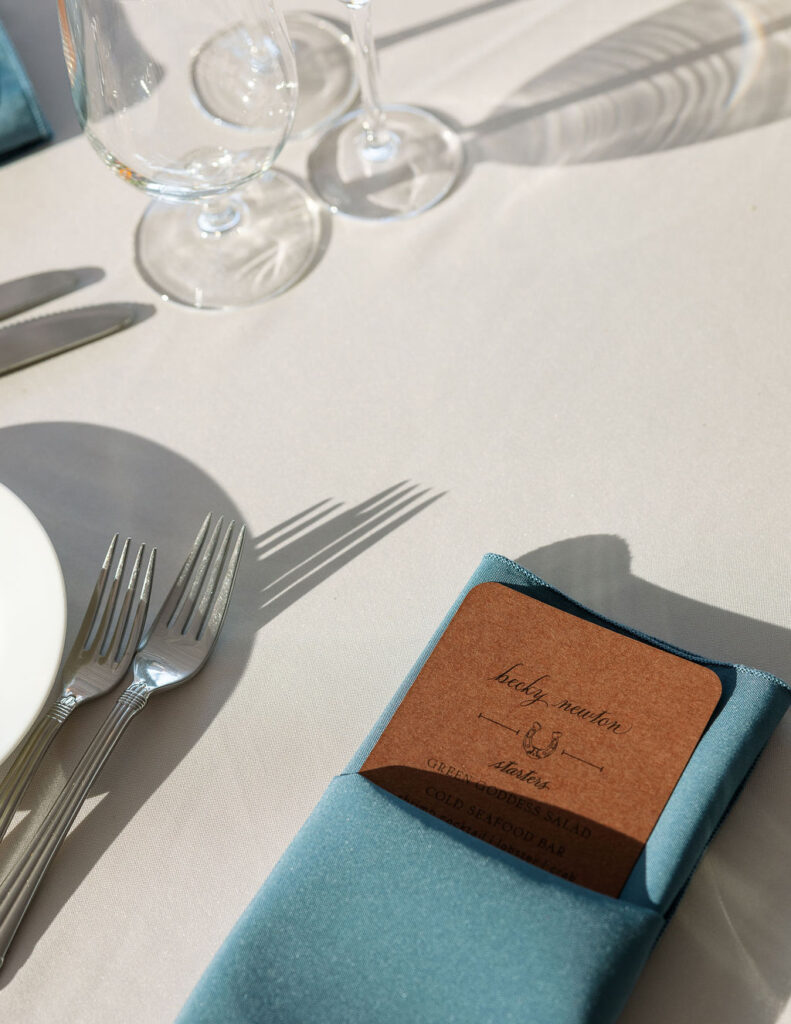 Tabletop place setting with leather name card and silverware