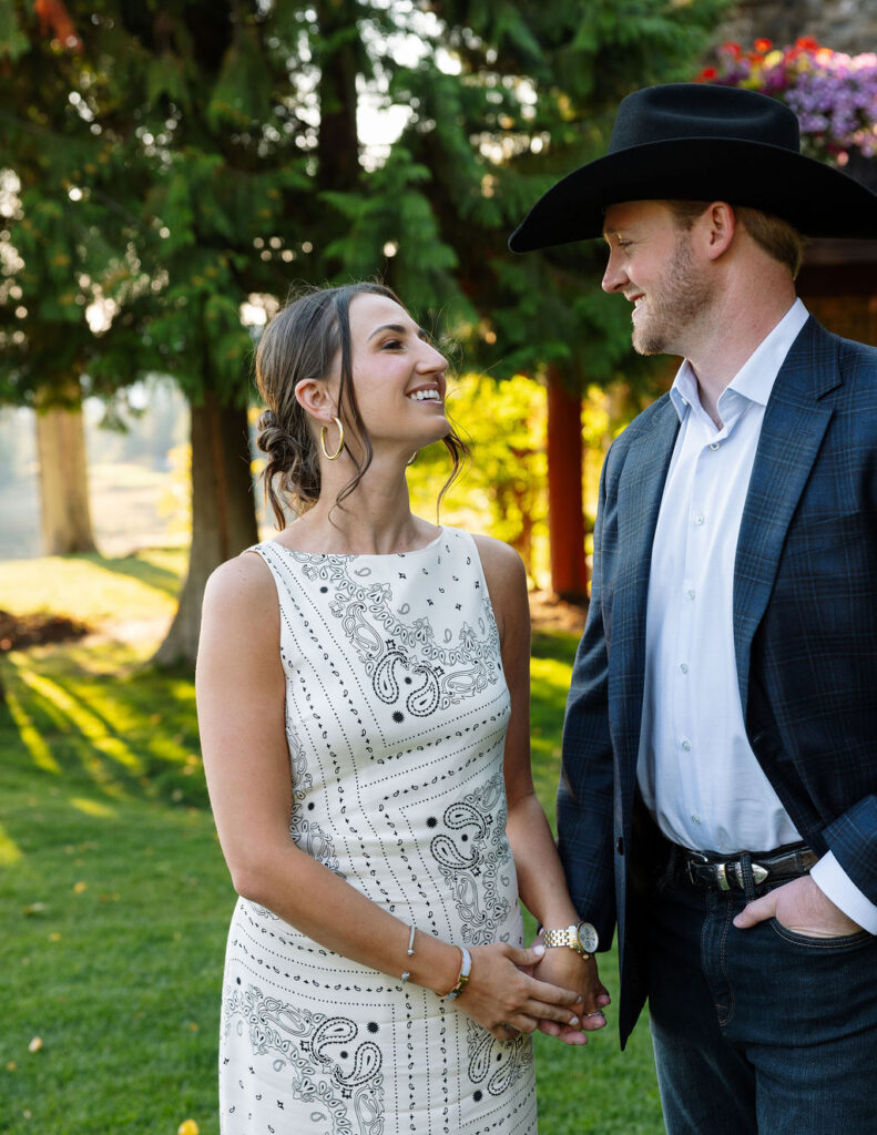 Bride and groom smiling at each other during rehearsal dinner portraits