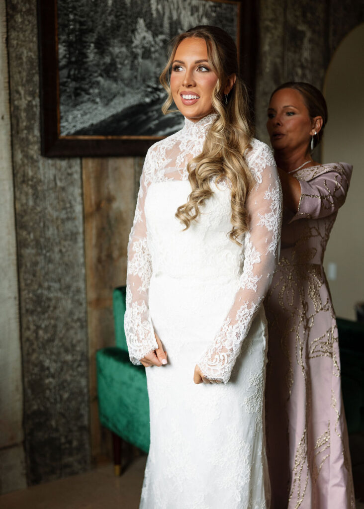 Bride getting ready with assistance before The Meadows on Rock Creek wedding