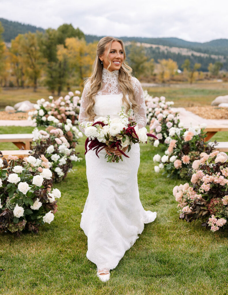 Bride portrait with floral ceremony backdrop at The Meadows on Rock Creek wedding