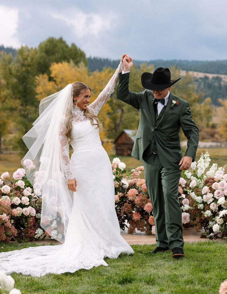 Bride and groom celebrating with family at The Meadows on Rock Creek wedding in Montana