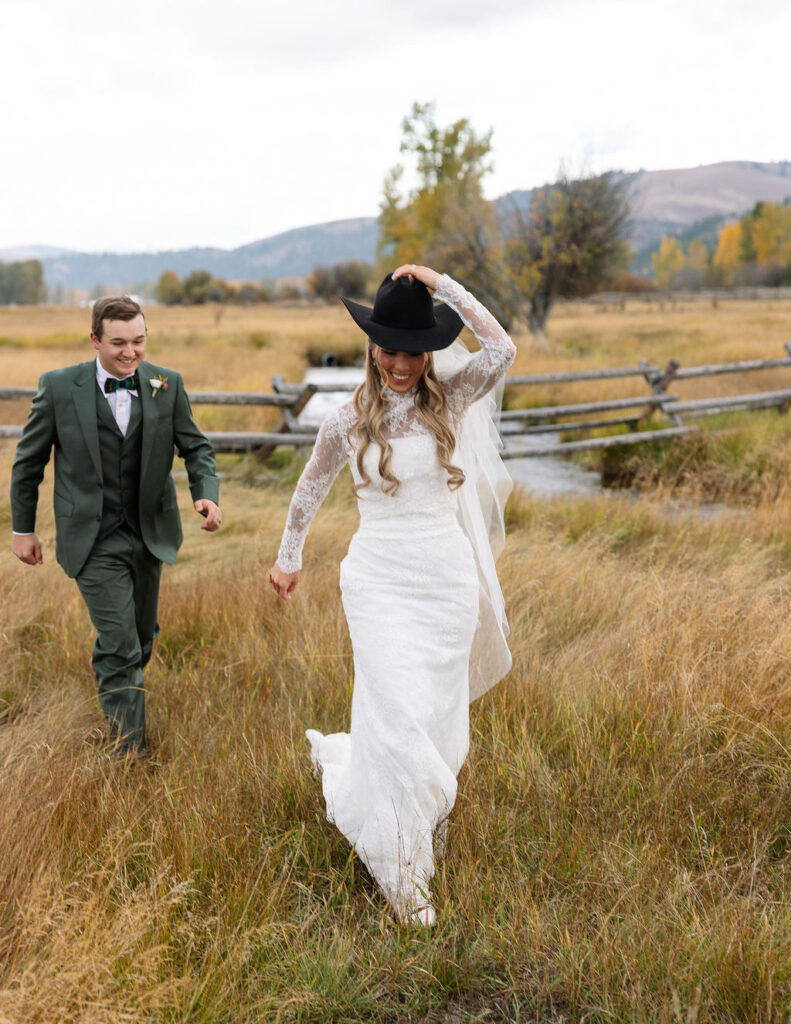 Bride and groom walking together during Montana ranch wedding at The Meadows on Rock Creek