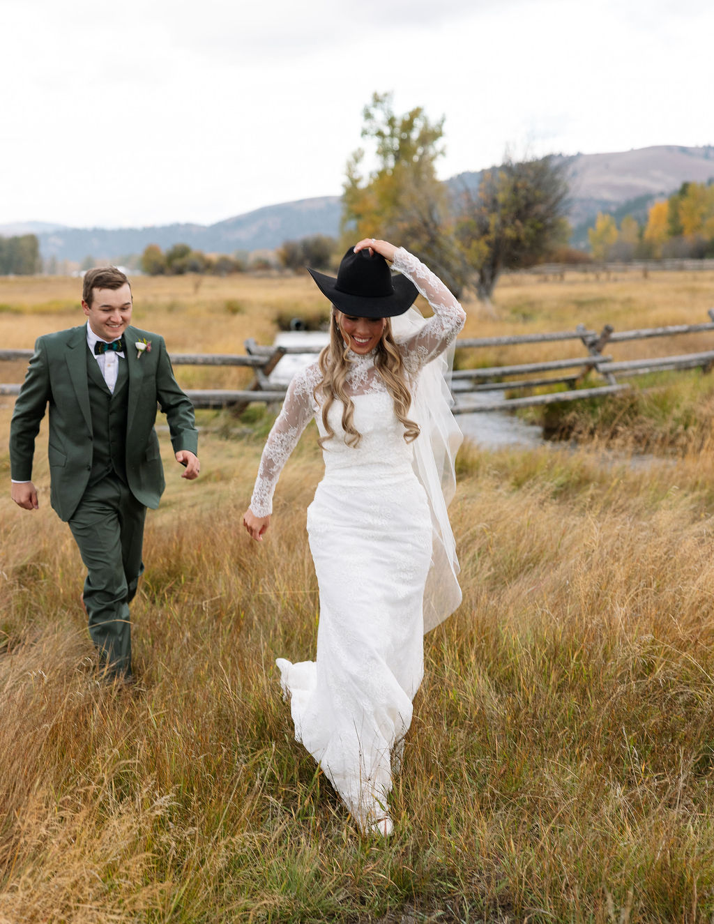 Bride and groom walking together during Montana ranch wedding at The Meadows on Rock Creek