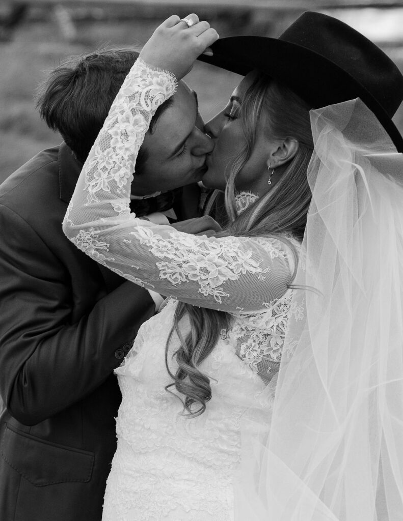 Black and white bride and groom kiss during The Meadows on Rock Creek wedding