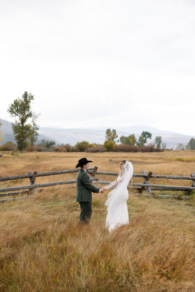 Bride twirling veil with groom at Montana ranch wedding venue