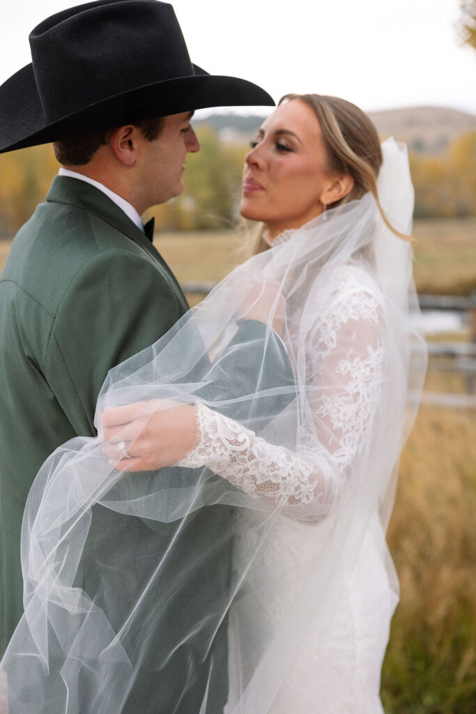 Bride and groom close portrait with fall foliage at Montana ranch wedding